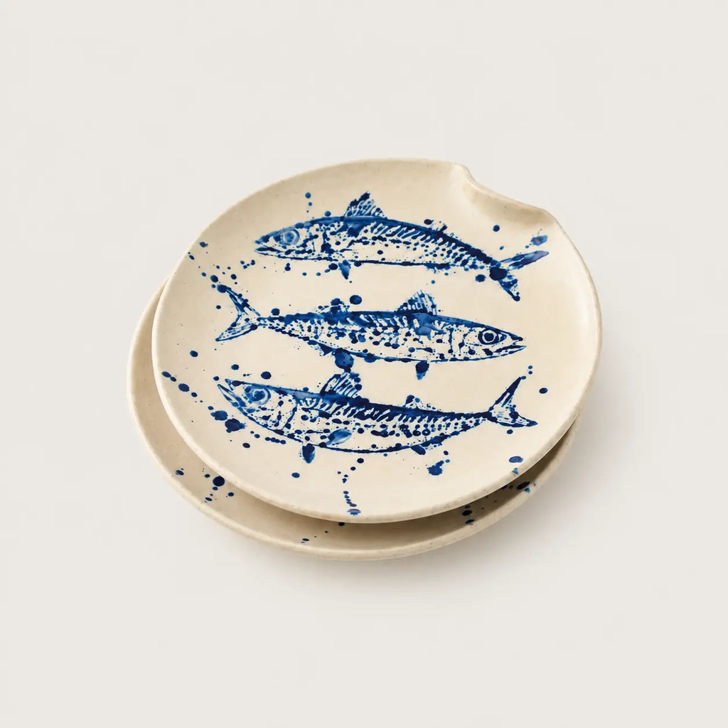 Angled view of 03 Tide cobalt blue fish dinner plate