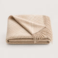 Ayni throw blanket in Vanilla tones, close up of this blanket folded