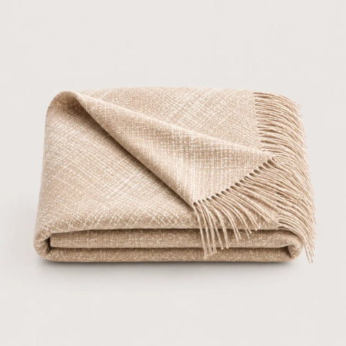 Ayni throw blanket in Vanilla tones, close up of this blanket folded