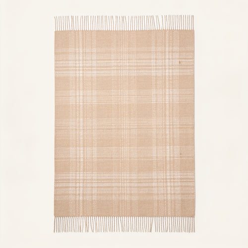 spread wide on the floor throw blanket alpaca in vanilla and beige colours. Purled long fringes