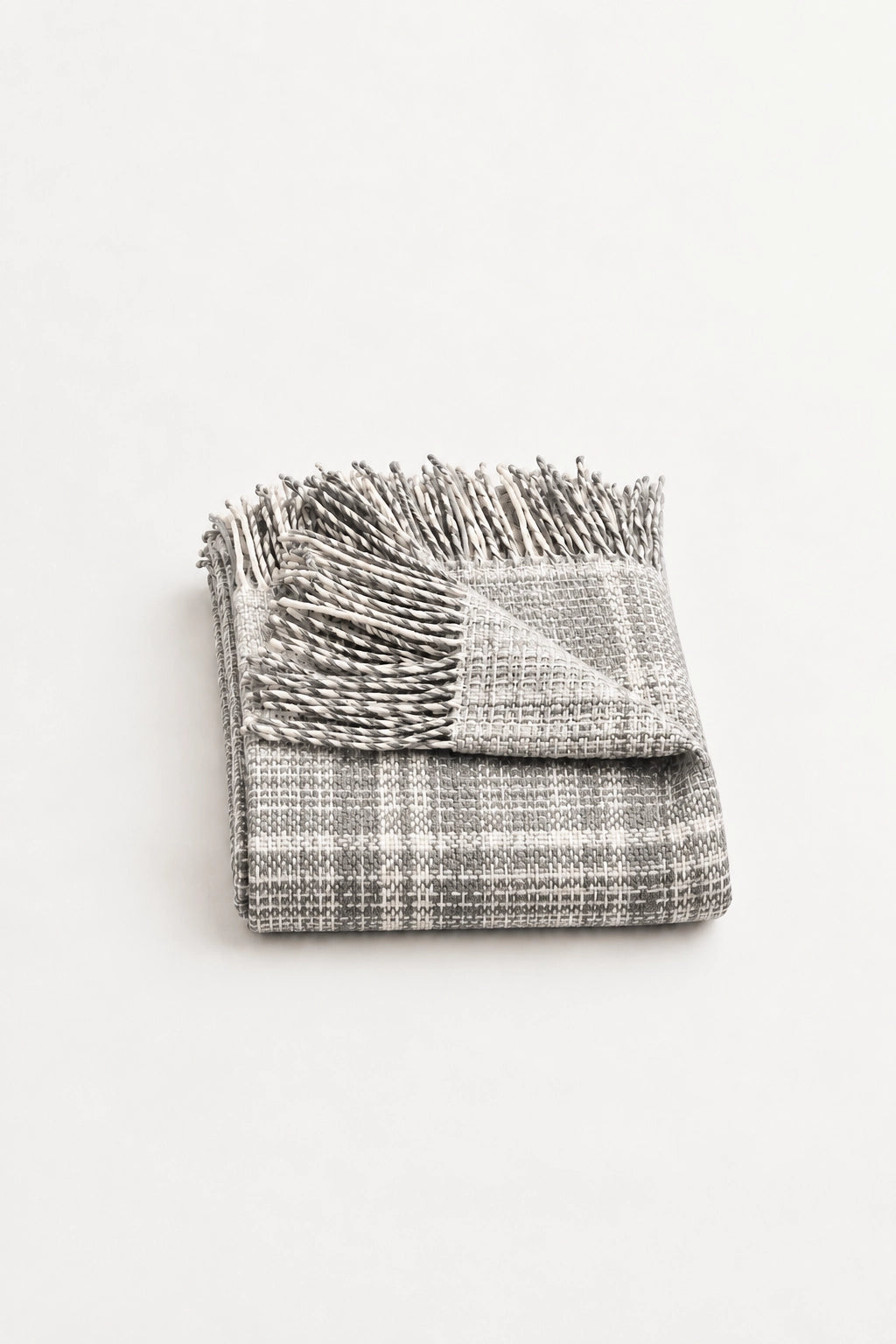 alpaca wool throw blanket in charcoal and bone colours, made in Peru