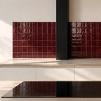 Burgundy red gloss ceramic tiles used on an interior wall