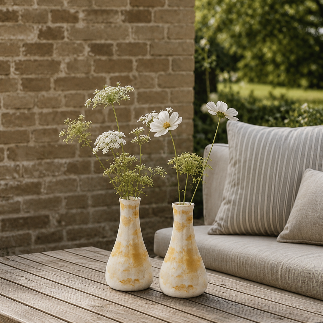 2 yellow vases on a table, terrace/ garden