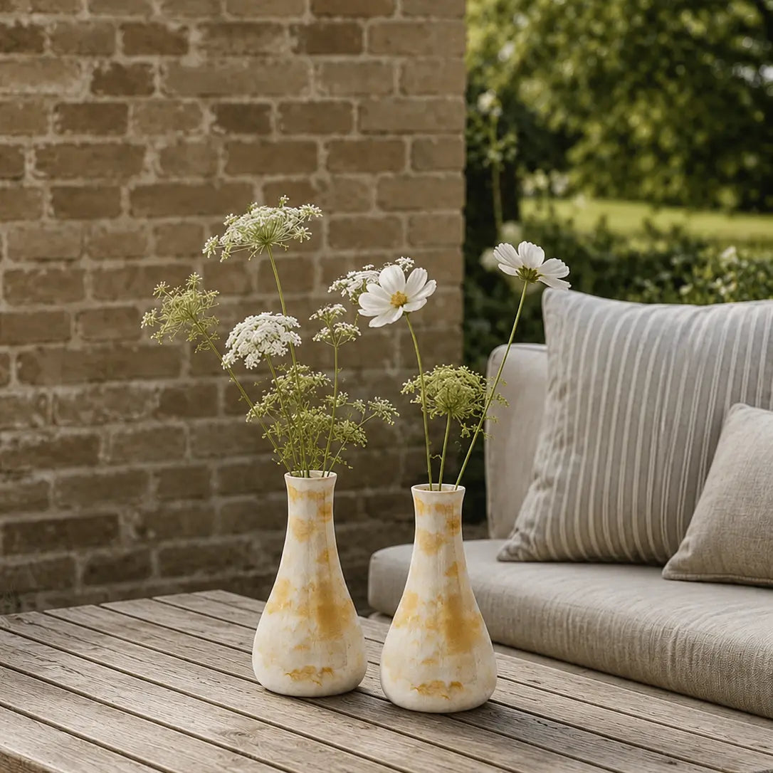 2 yellow vases on a table, terrace/ garden