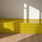 Citron yellow gloss ceramic tiles used on an interior wall