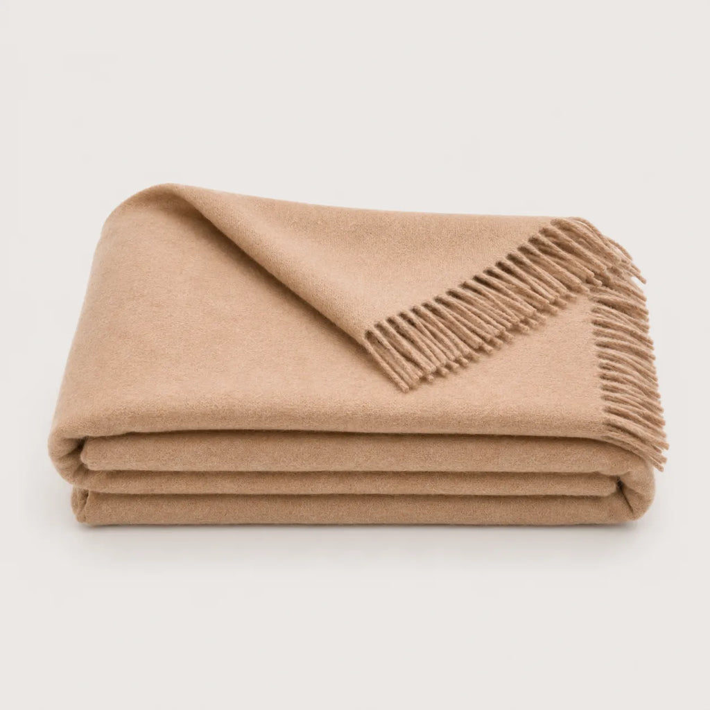 alpaca throw blanket in light beige folded