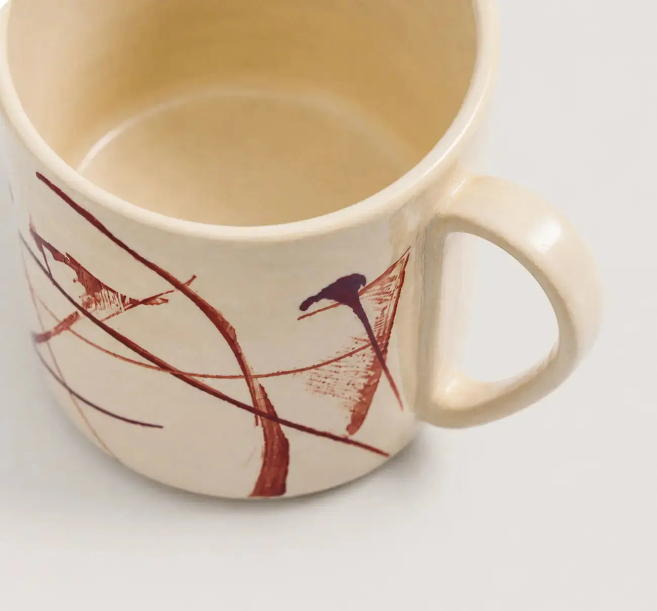Porcelain mug with artistic design on a white background