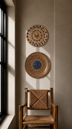 Chair in a living room with two hand painted decorative wall plates