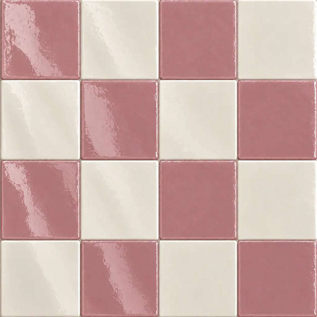 Glossy checkered mosaic tile pattern featuring alternating dusty pink and warm off-white square tiles.