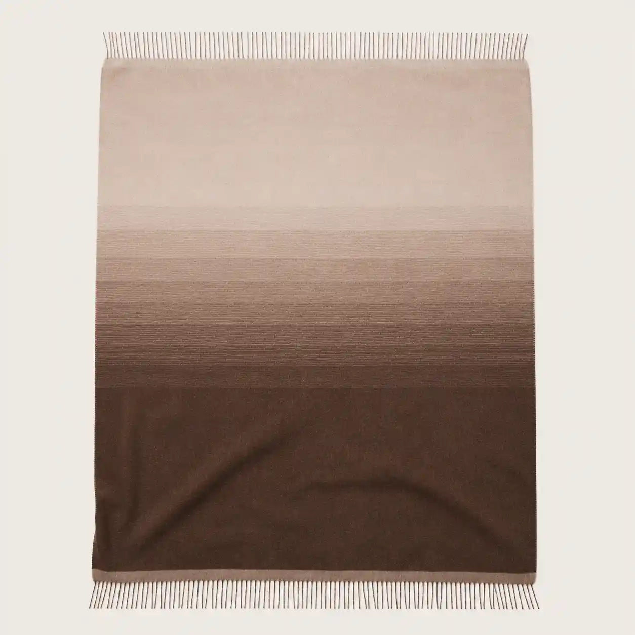 throw blanket in matiz design in chocolate brown and sand colours. Woven with Alpaca fibres