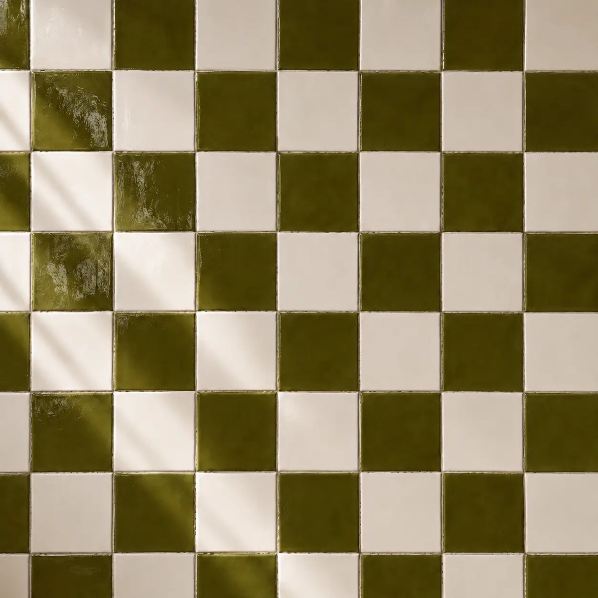 Moss green and white ceramic tiles in checkerboard pattern