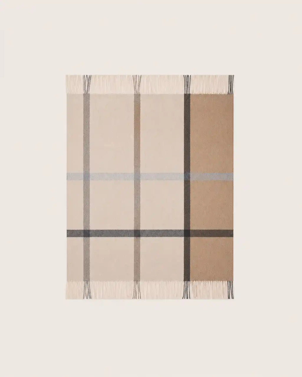 A rectangular woven throw blanket with a classic check pattern in beige, tan, brown, and gray, featuring fringed edges on all sides, shown flat against a light off-white background.