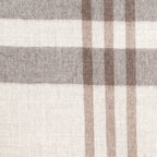 A close-up of a woven plaid throw blanket with a check pattern in beige, brown, and gray.