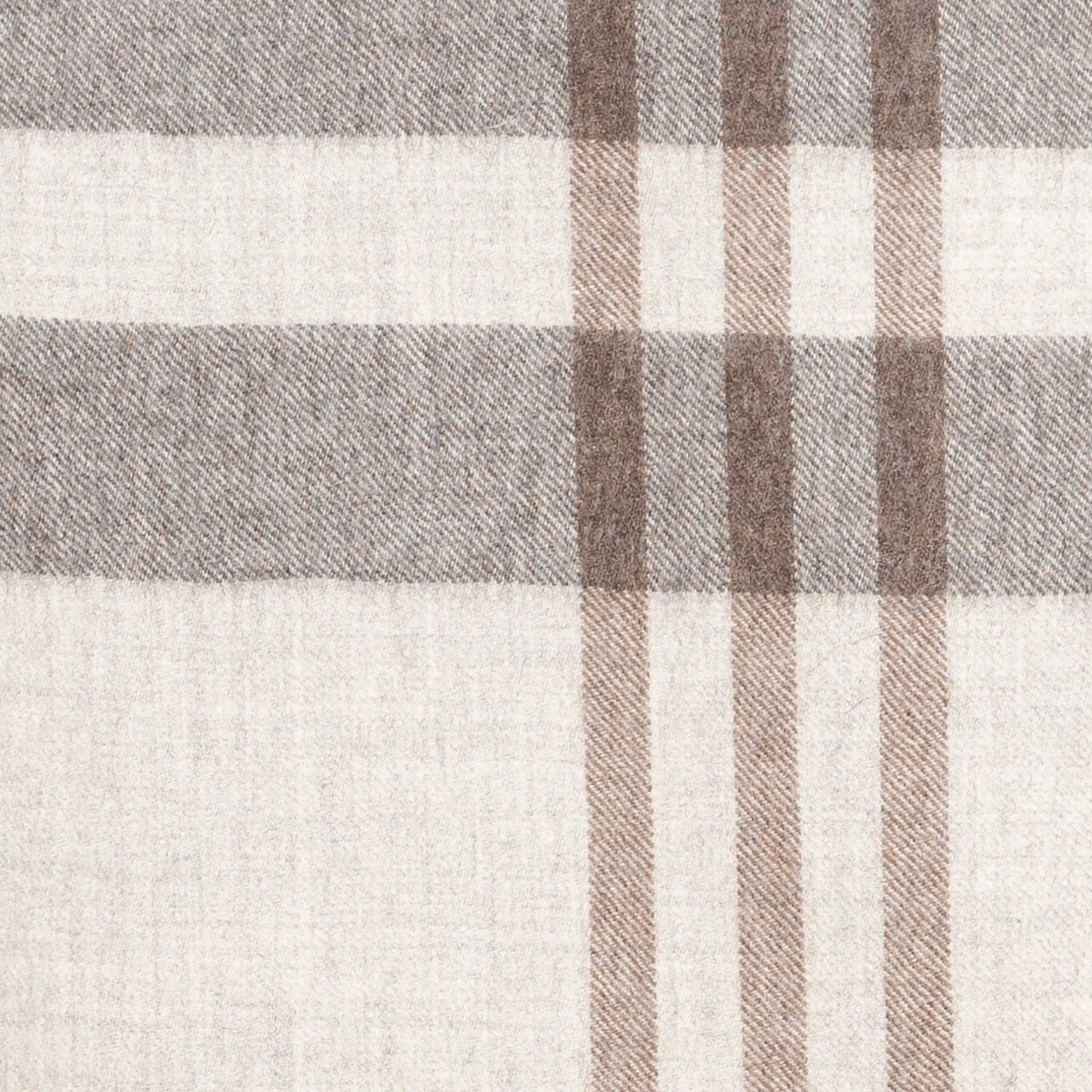 A close-up of a woven plaid throw blanket with a check pattern in beige, brown, and gray.