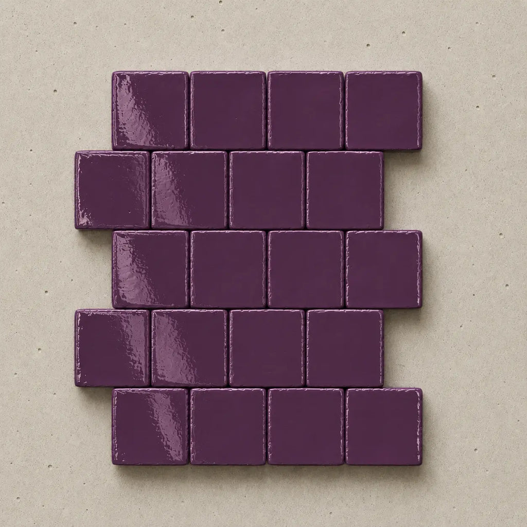 Handmade plum ceramic tiles showing natural variation