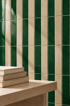 forest green rectangular gloss tile wall with table nearby