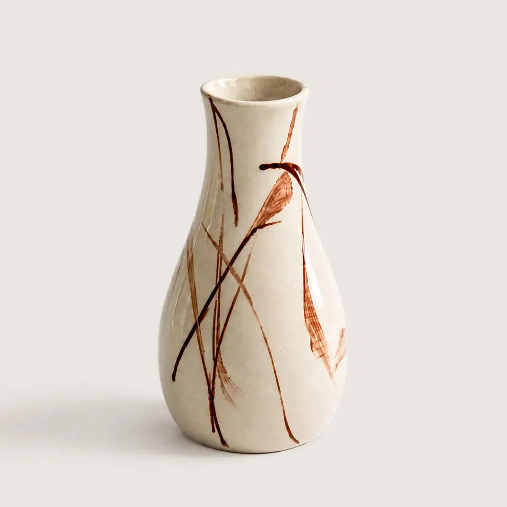 Ceramic vase with brown abstract patterns on a light gray background