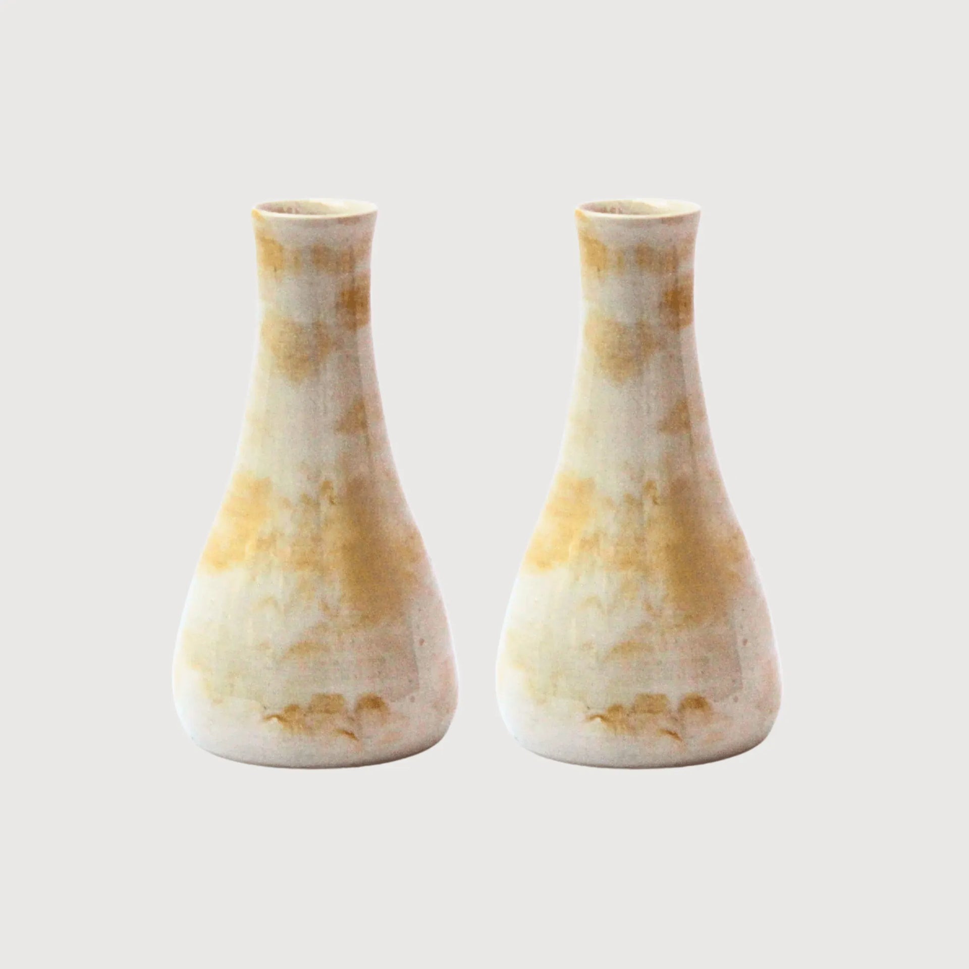 Hand-thrown stoneware vase with organic amber and blush wash glaze, wide base tapering to a narrow neck, hand-painted in Spain by Cardoon Studio.