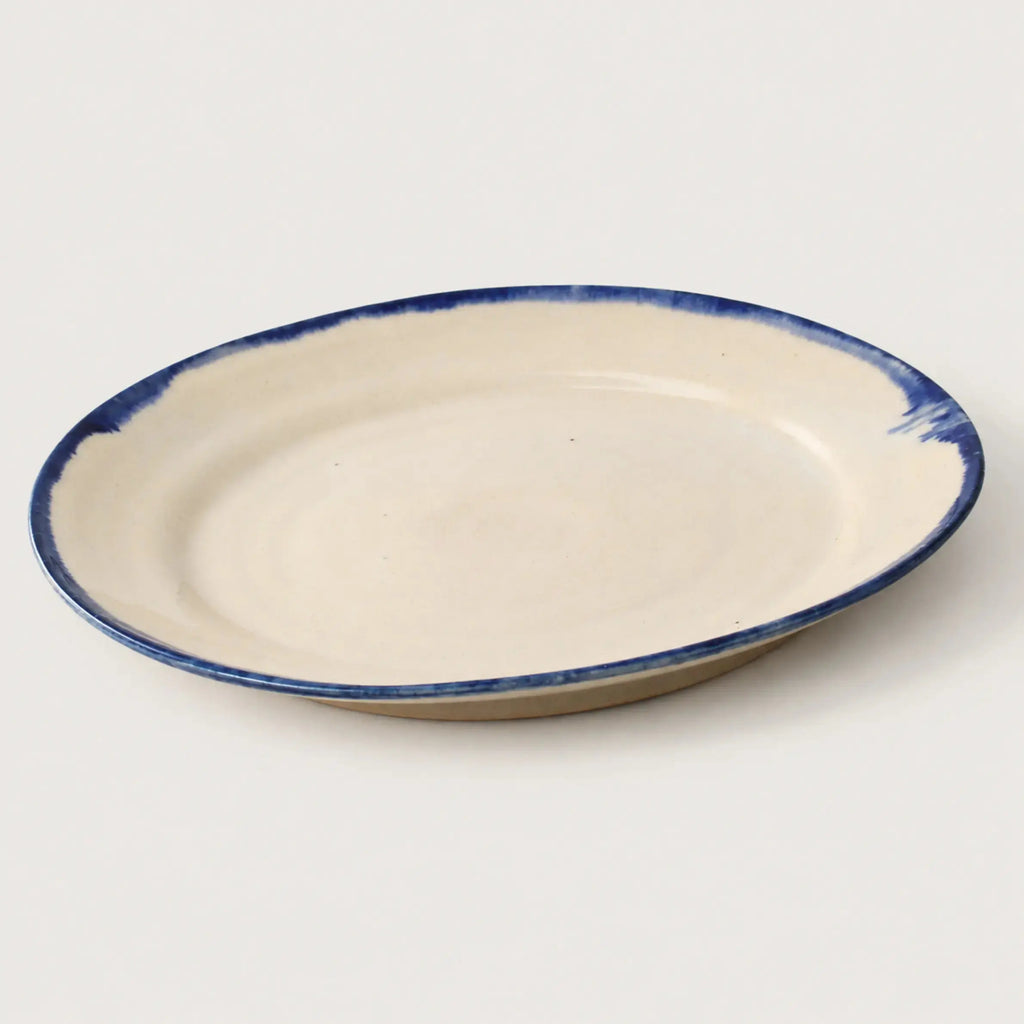 Underside of handmade Shoreline stoneware dinner plate