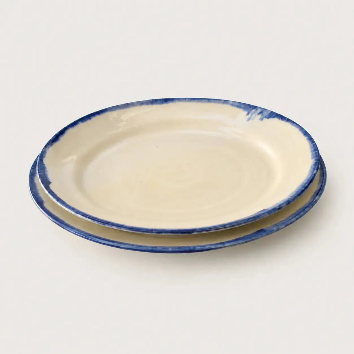 Shoreline handmade stoneware dinner plate in cream and cobalt blue