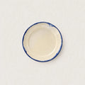 Close-up of hand-painted cobalt blue rim on Shoreline stoneware plate