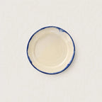 Close-up of hand-painted cobalt blue rim on Shoreline stoneware plate