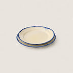 Shoreline cream stoneware side plate with hand-painted blue rim