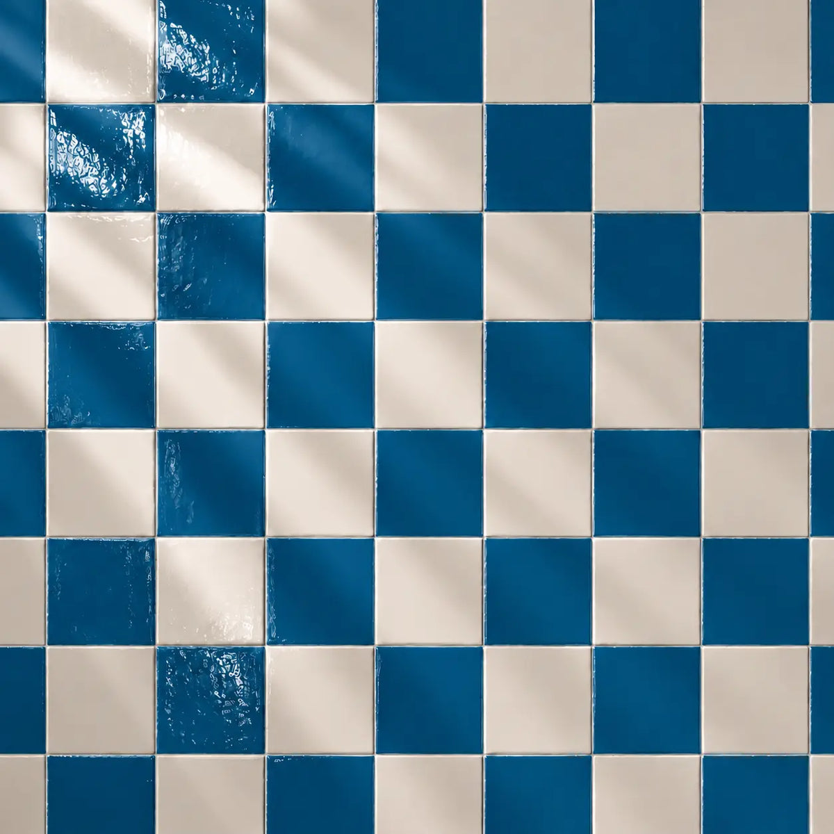 Checkered pattern of teal blue and beige tiles
