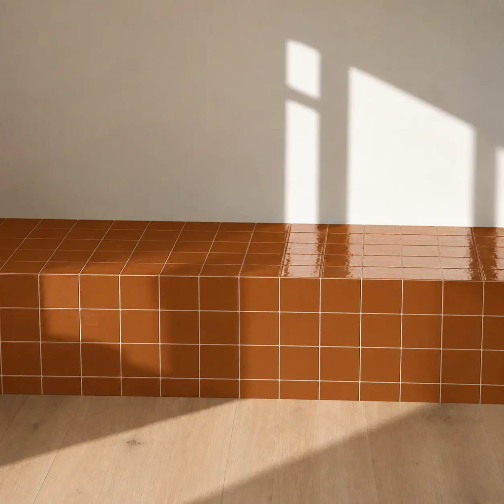 Terracotta orange ceramic tiles used on an interior wall