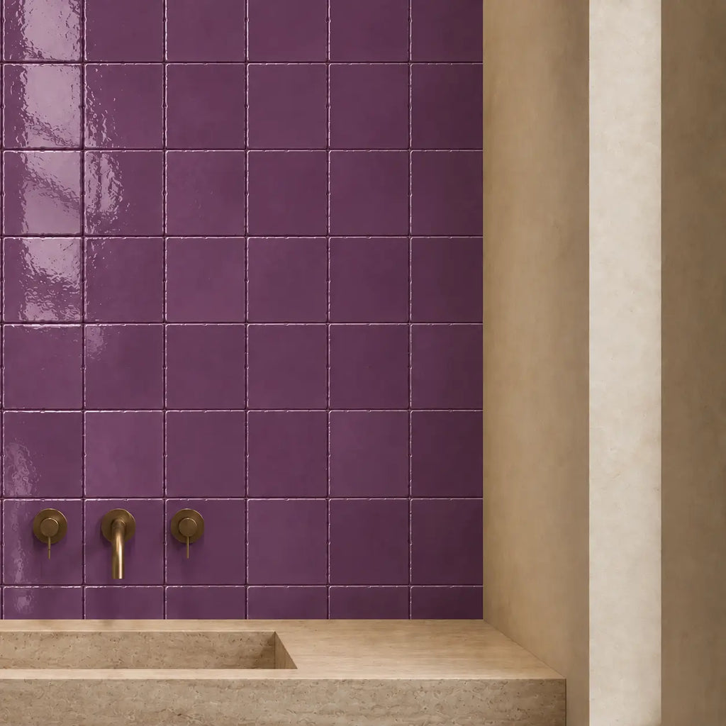 Violet gloss ceramic tiles used on a bathroom wall