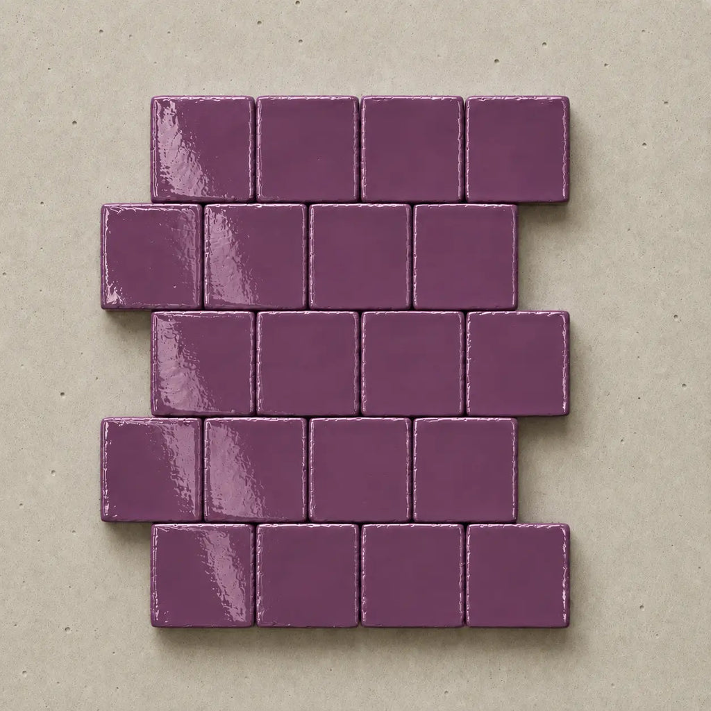 Handmade violet ceramic tiles showing natural variation