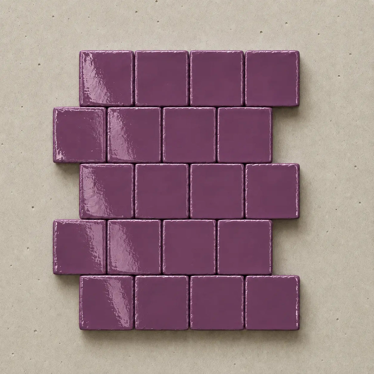 Handmade violet ceramic tiles showing natural variation